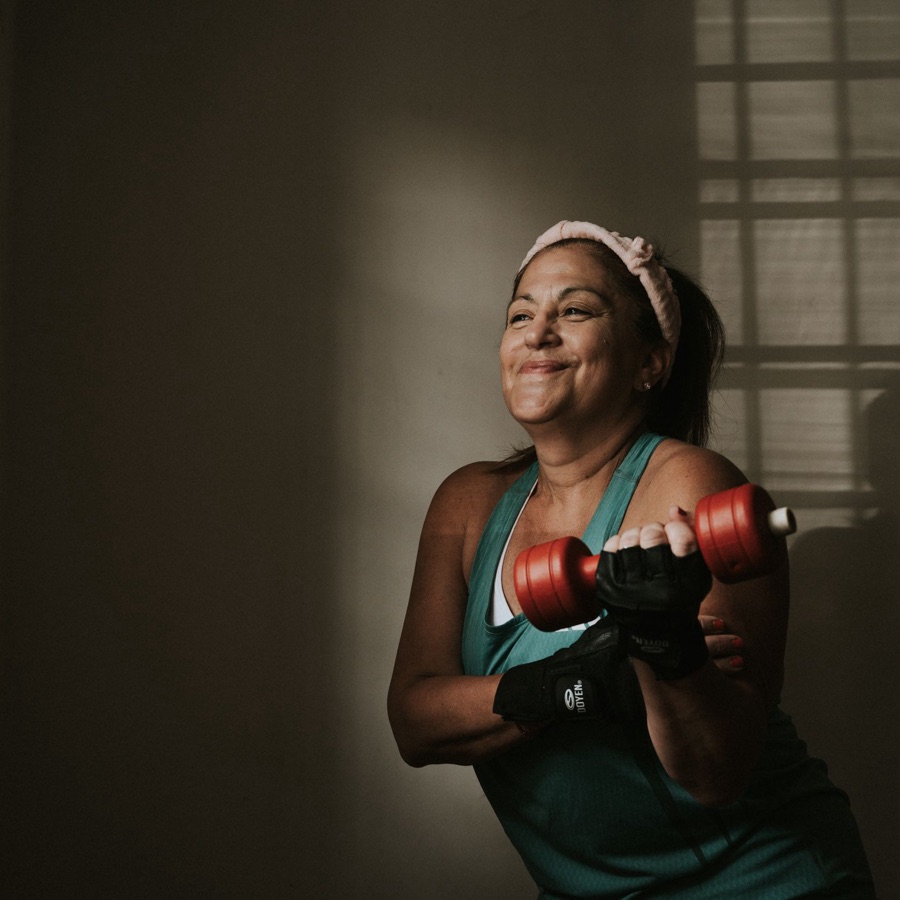 Woman training with dumbbells